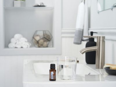 A pair of neatly folded towels and a water bottle.