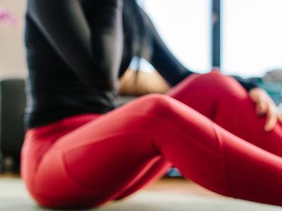 Close-up of a yoga mat on a wooden floor.